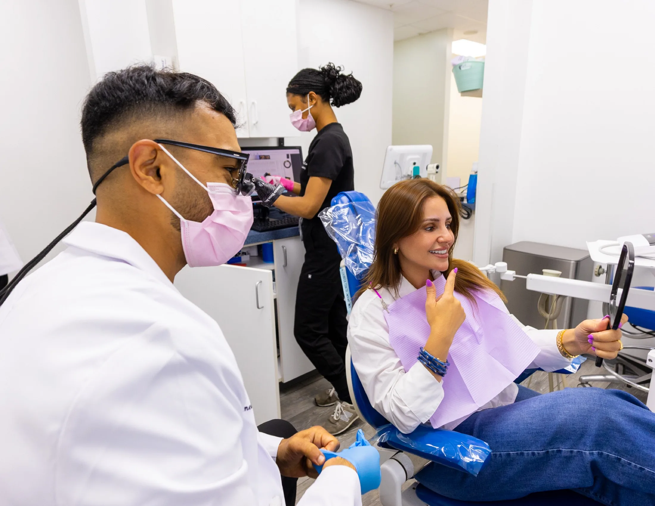 A patient smiling with the dentist at Advanced Dental Care of Fredericksburg