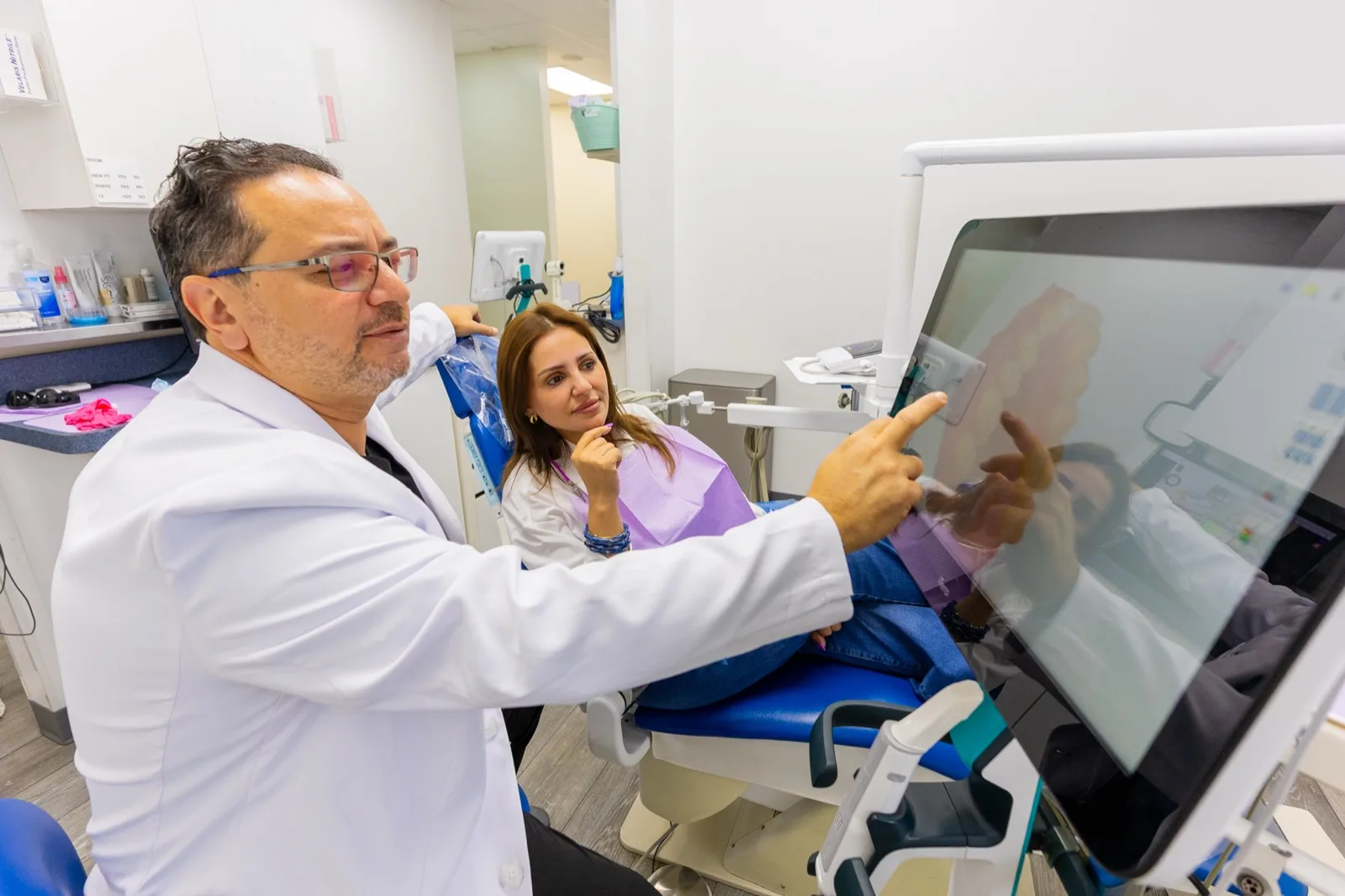 Dr. Arafa presenting a 3D implant scan to a patient